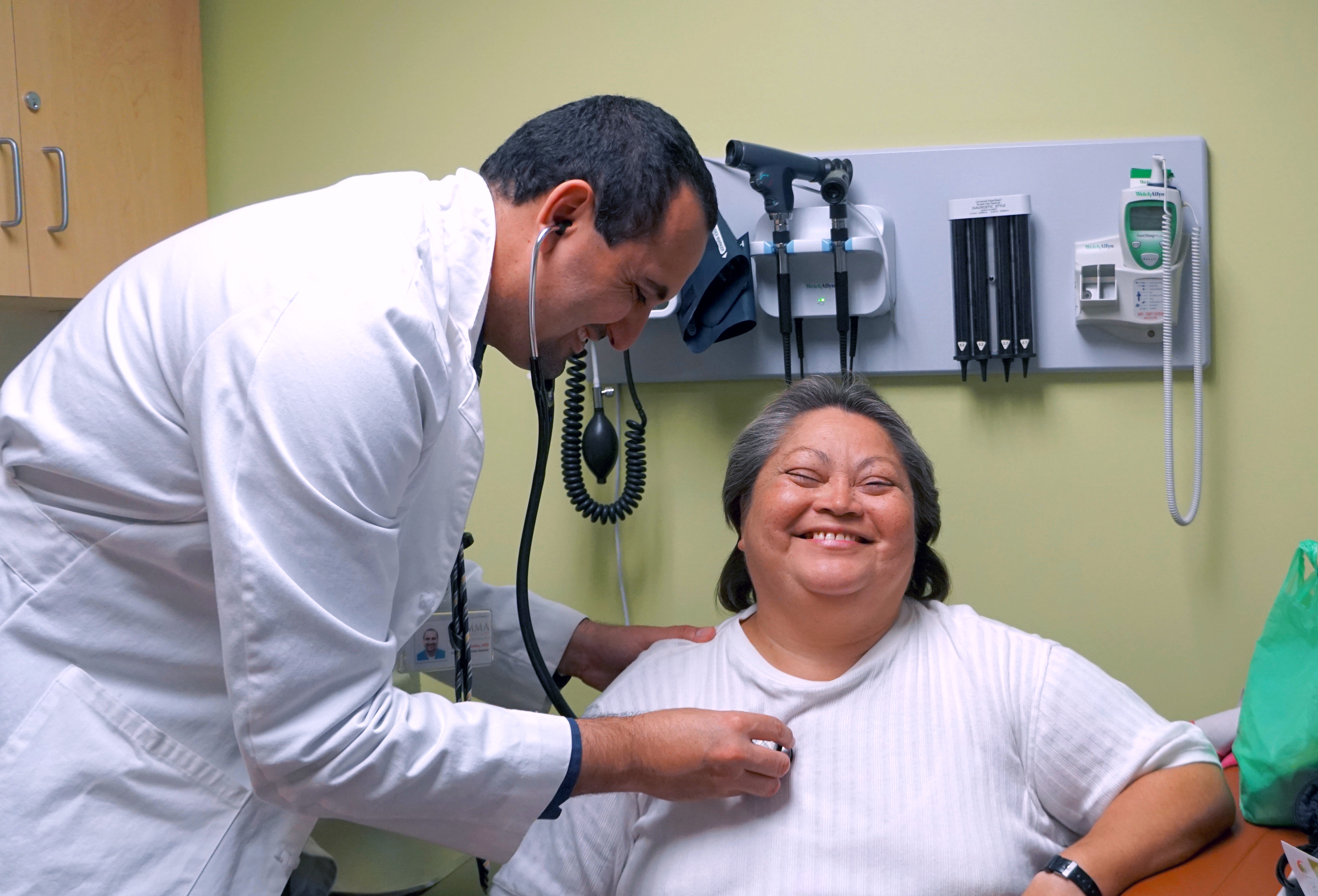 Pictured: Dr. Cesar Barba cares for a long-time UMMA patient at the Fremont Wellness Center